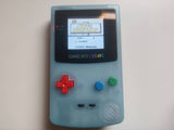 Enhanced Nintendo Gameboy Color - Sky Blue Glow Edition with Backlit Screen, New Housing, Speaker, and Buttons. A Custom Retro Gem for Immersive Gaming.