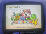 Game Boy Advance displaying a colorful game screen with characters and text.